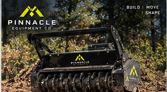 Pinnacle forestry mulching attachment in a wooded setting